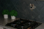 Keuken met vloertegels diagonaal op wand